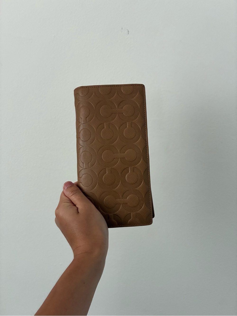 Accessory item held against wall